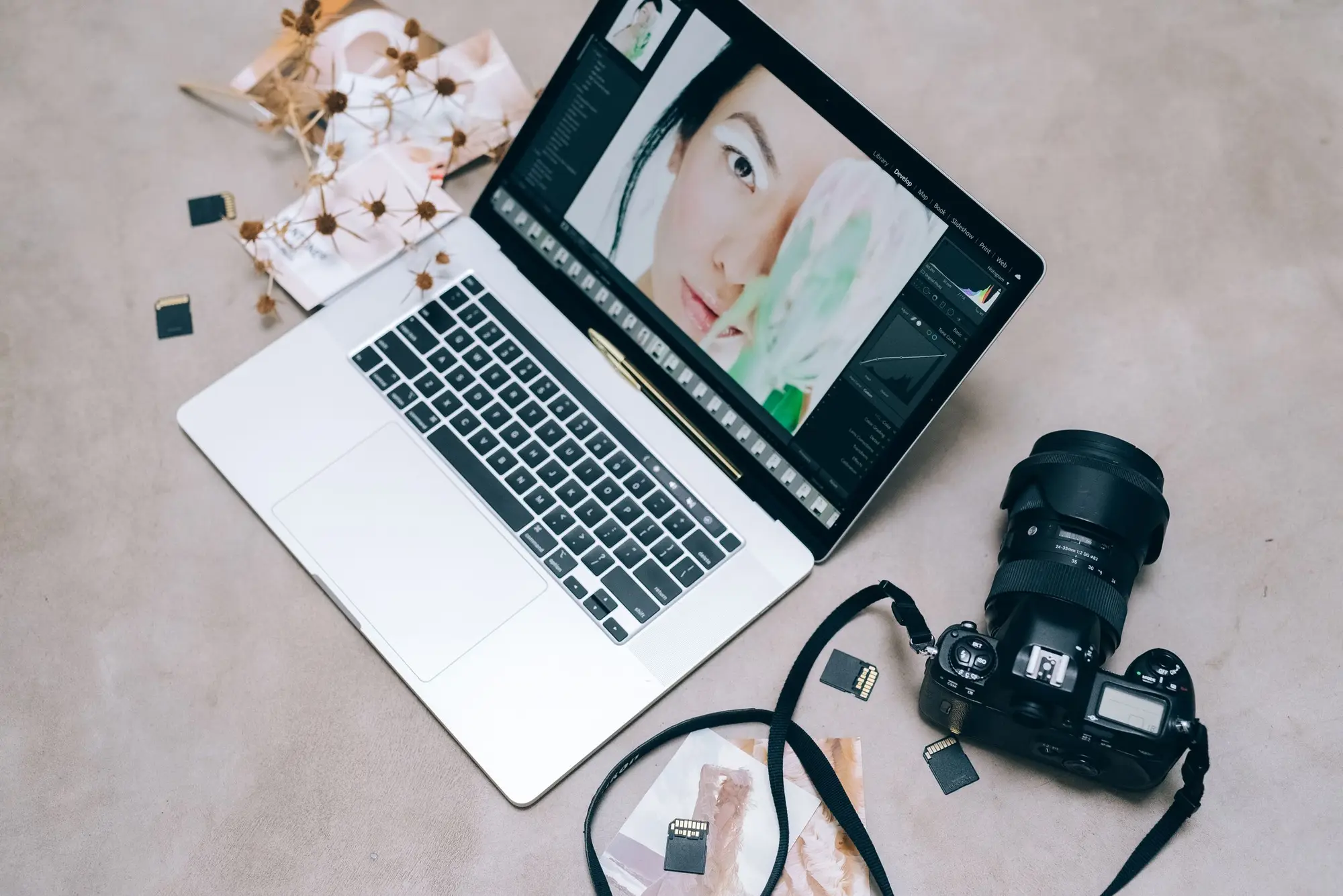 Laptop and camera on a desk, ready for product photography