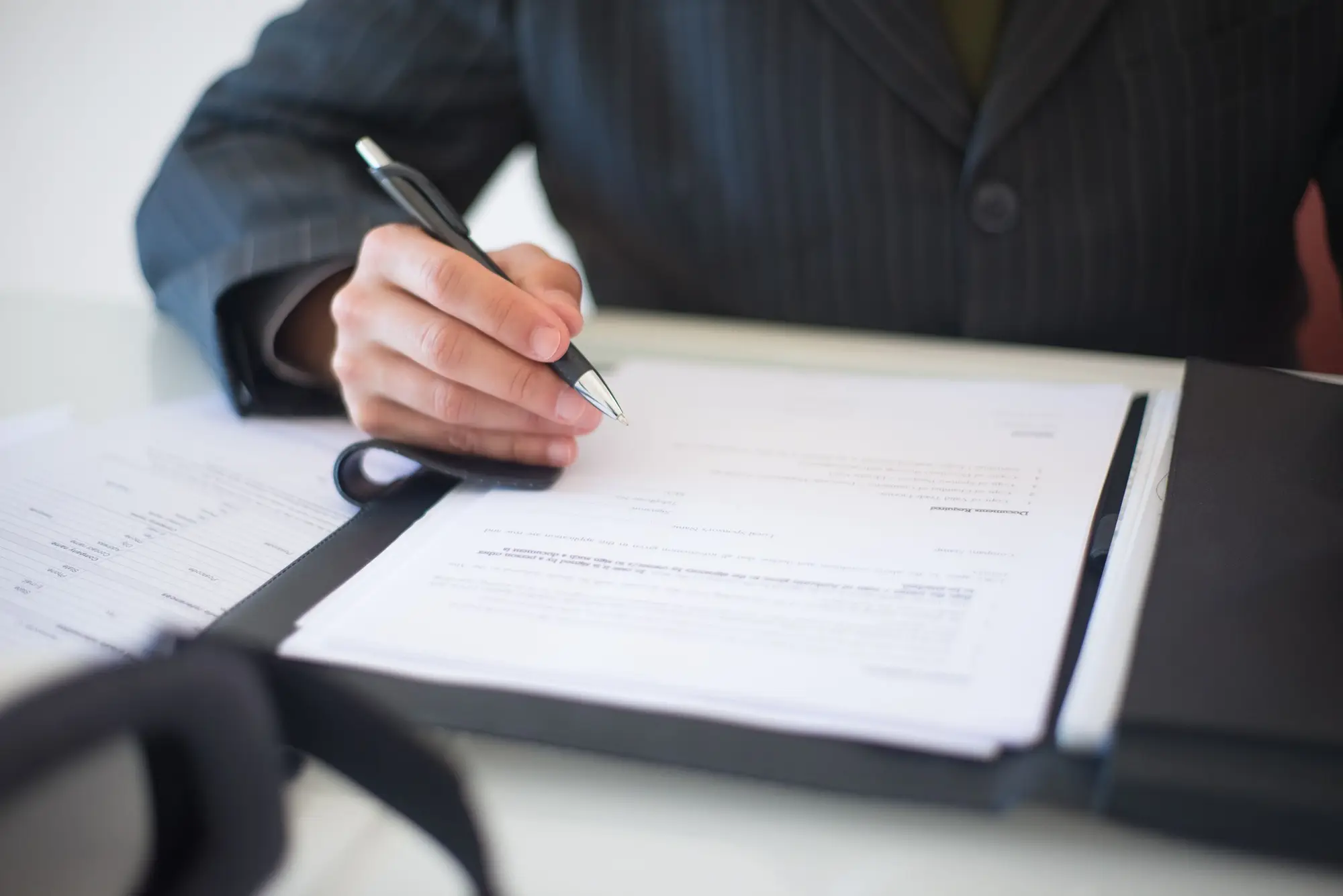 Person signing a contract